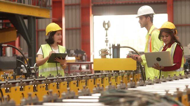 Supervisors inspecting production workflow and monitoring factory operations with digital technology. Manufacturing management, industrial innovation and operational efficiency.