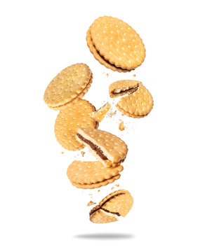 Crispy biscuits with chocolate filling floating in the air on a white background