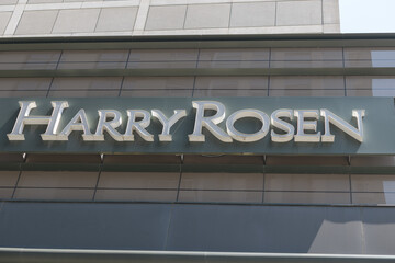 Obraz premium shop sign outside Harry Rosen, a men's clothing store, located at 82 Bloor St W, Toronto