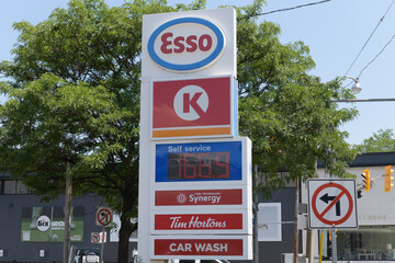 Obraz premium street side pylon at Esso, a gas station chain, located here at 150 Dupont St, Toronto