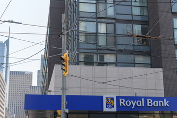 Obraz premium exterior building and sign of RBC Royal Bank branch located at 101 Dundas St W, southwest corner of Bay St, Toronto