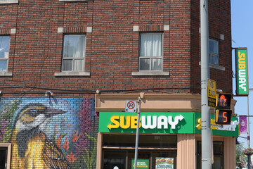 Obraz premium exterior building and sign of Subway, a sandwich shop chain, located here at 1123 St Clair Av W, Toronto