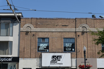 Obraz premium exterior building facade and sign of Shape Fitness located at 1156 St Clair Av W, Toronto (formerly St Clair Theatre, built 1921)