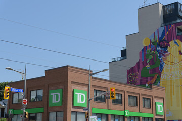 Obraz premium exterior building and corporate logo sign outside a TD bank branch located at 870 St Clair Av W; and huge mural art by Yasaman Mehrsa called 
