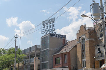 Obraz premium rooftop metal wayfinding sign at Kensington Market, Toronto
