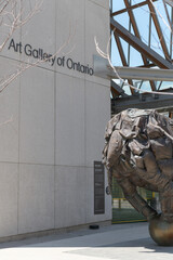 Obraz premium wall sign and the rearward portion of Couch Monster, Art Gallery of Ontario, 317 Dundas St W, corner of McCaul St, Toronto