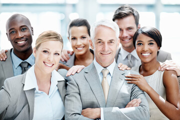 Obraz premium Corporate, portrait and business people in office for team support, partnership and about us for insurance. Lobby, happy and men with woman for solidarity, trust and assurance for asset management