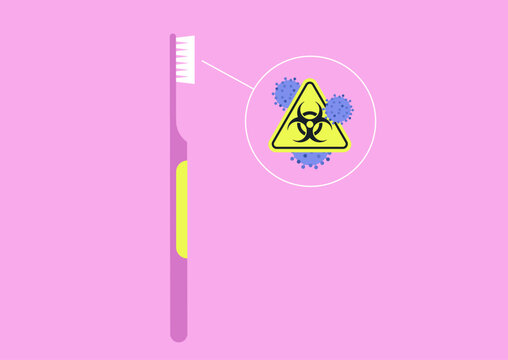A toothbrush stands upright, showcasing tiny bacteria lurking on its bristles, highlighting the need for thorough cleaning and awareness in daily oral care routines