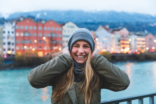 Woman smiling at camera enjoying city travel in Innsbruck