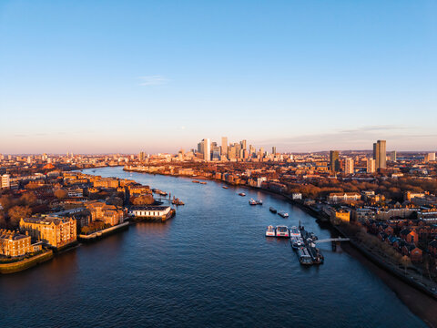 London Canary Wharf skyline and River Thames at sunset