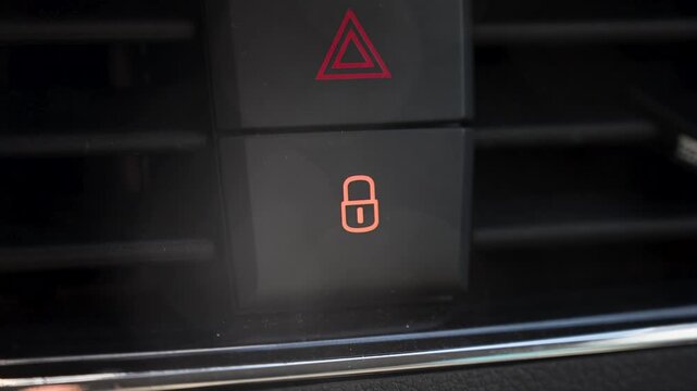 Car lock button on dashboard. Central locking switch in vehicle interior.