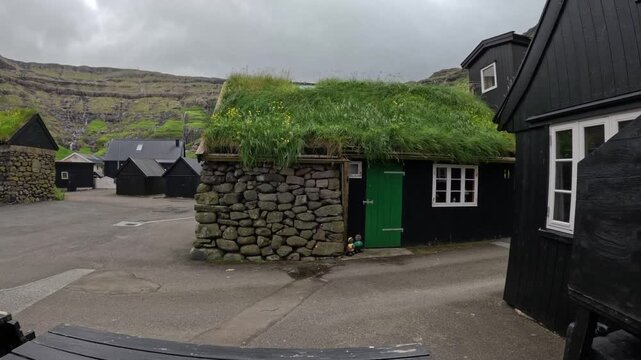 Traditional historic turf roof house in Tjornuvik village, Faroe Islands