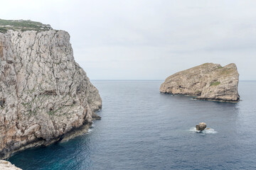 Obraz premium Capo Caccia cape western vertical cliffs and Foradada island, Alghero, Italy