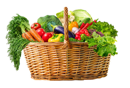 A Fresh Vegetable wicker Basket Overflowing with a Variety of Organic Farmer Produce on white