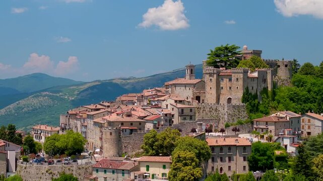 Collalto Sabino Italy 70mm 4K Drone. Cinematic aerial close up of hilltop borgo village with medieval castle. Epic mountain background scenic Lazio region travel destination hidden gems
