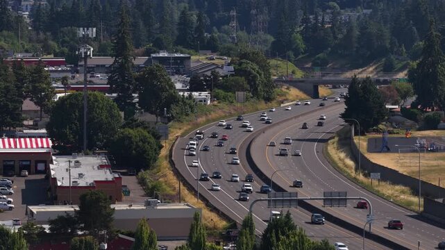 Aerial of I5 through suburban commercial corridor in Hazel Dell Washington State showing heavy traffic flow