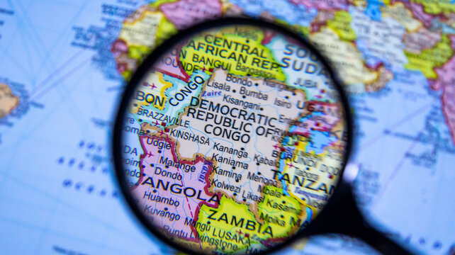 Magnifying glass over Democratic Republic of Congo, Africa on political world map.