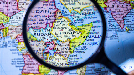 Map of East Africa under magnifying glass. Exploring Ethiopia, Kenya, Somalia. © Photo Agency