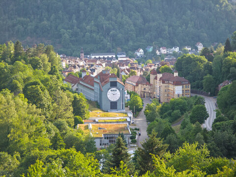germany, spectacular sunset panorama above schramberg village revealing timeless schwarzwald architecture framed by rolling green hills and vivid summer sky
