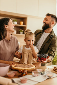 Family baking together and having fun in kitchen