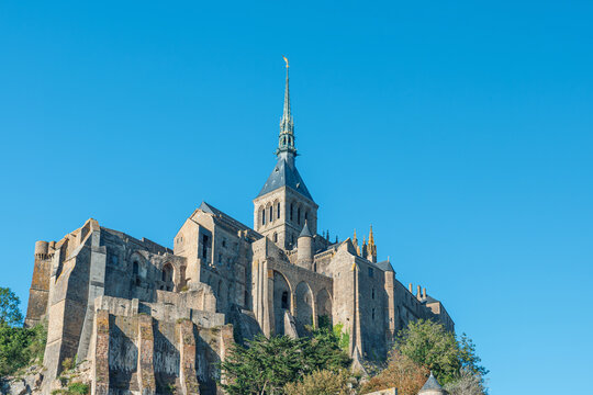 Close up view of Mont Saint Michel Abbey with Gothic architecture and historic stone construction in Normandy, France. Tidal island with medieval monastery in Normandie. French tourism
