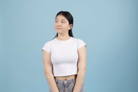 Young woman standing straight posing confidently looking forward