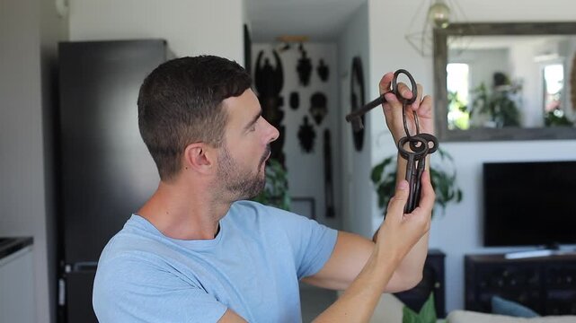 Man holding large ancient keys 