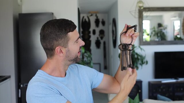 Man holding large ancient keys