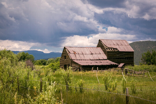Rustic Cabins Under Storm Clouds