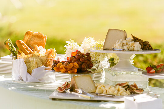 Outdoor Party Table with Cheese and Fruit