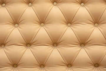 Obraz premium Beige tufted leather texture with buttons creating a luxury upholstery background pattern