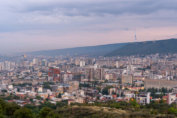 Obraz premium View of Tbilisi in the evening, modern residential buildings. New development of Tbilisi