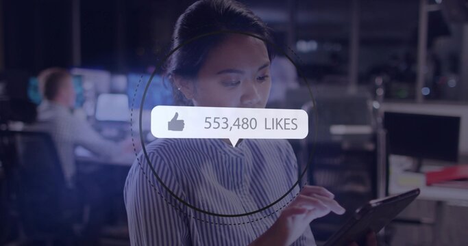 Main subject tapping and swiping tablet when floating likes overlay appearing, monitoring growth