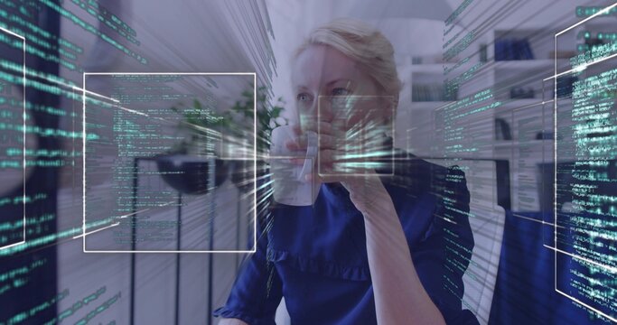 Office worker sipping white mug and returning gaze, causing HUD code converging for data analysis