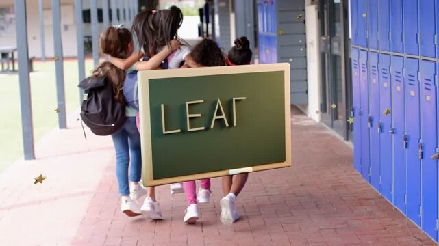 Four girls walking arm-in-arm down campus heading to exit sending chalkboard sliding showing LEARN
