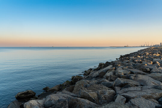 Beautiful Black Sea landscape, Poti city coast. Large stones on the shore. Morning