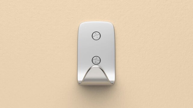 Silver metal clothes hook mounted on wall