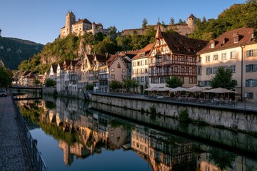 Naklejka premium Charming European market square in Feldkirch with cobblestones, outdoor cafes, and alpine backdrop