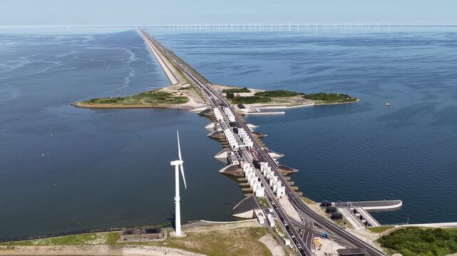 Afsluitdijk causeways flood defence and wind turbines aerial view