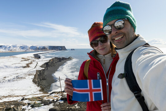 Happy man with his wife visiting Iceland in winter season.