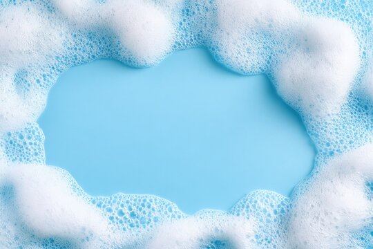 White soap foam bubbles forming an organic frame around a light blue background, creating a clean and fresh visual effect suitable for various design applications