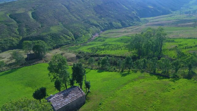 Aerial view from a drone of the winter landscape around the village of Vega de Pas. Pasiegos Valleys region, Cantabria, Spain, Europe