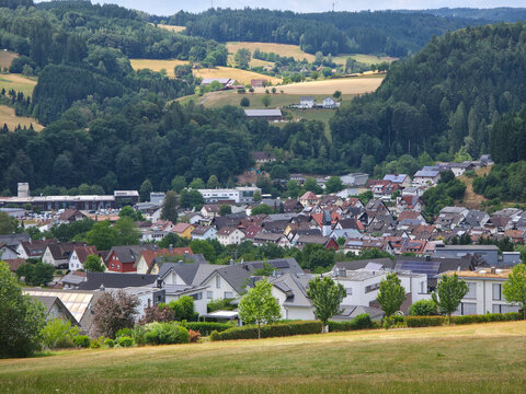 germany, breathtaking panorama above elzach black forest village rooftops glowing beautifully beneath radiant summer sunset and endless colorful evening sky
