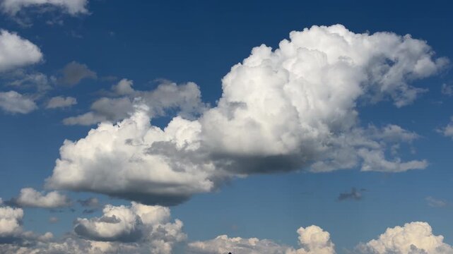 Clearing sky time lapse with cumulus cloud and sunny weather transition