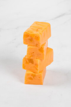 Vegan Apricot dessert, candy with pieces of dried apricots. White background. Close-up