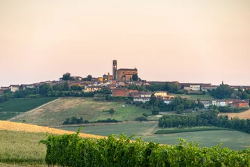 Hilltop Village with Historic Church and Vineyards in Piedmont, Italy, at Sunset © schame87