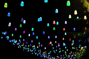 Colorful hanging lights illuminating a night scene in Svetlogorsk, Baltic summer © photopixel