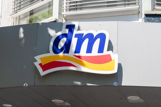 Mainz, Rhineland-Palatinate, Germany - July 11, 2026: DM logo displayed on a building in a city setting