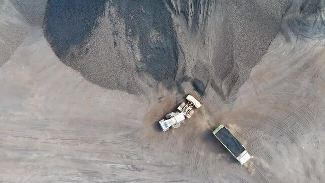 Drone view from a coal mining site in South Kalimantan shows trucks and heavy equipment in action