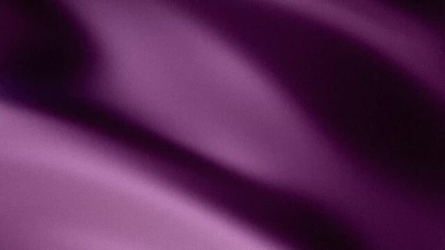 Abstract grainy purple background with soft flowing light and shadow